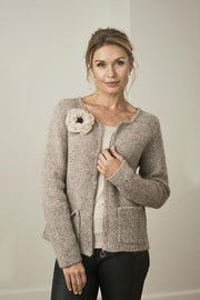 Aura knitted cardigan with pocket and a flower attached, made in grey Jensen yarn and silk mohair, the front